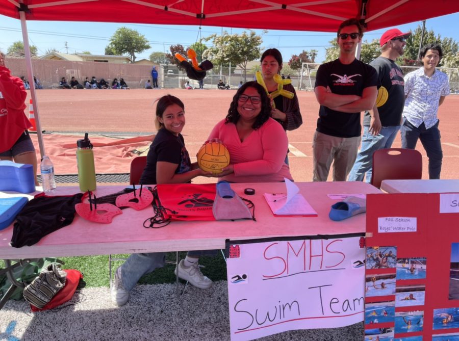 The swim and water polo teams shared a booth at the event to promote their programs. Pictured: Quetzalli Mitchell and Millie Fernandez