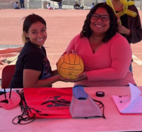 The swim and water polo teams shared a booth at the event to promote their programs. Pictured: Quetzalli Mitchell and Millie Fernandez