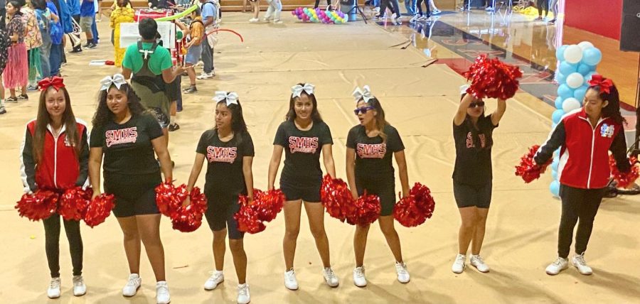 junior cheerleaders lead the crowd in school spirit.