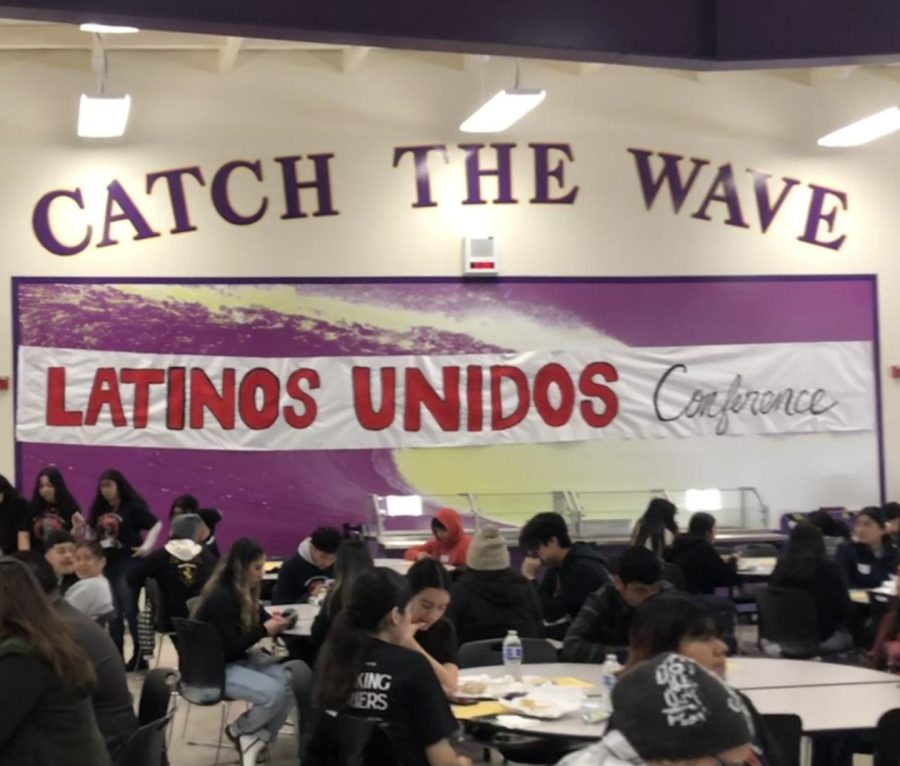 Inside+the+cafeteria%2C+where+the+painted+banner+was+placed+for+the+Latinos+Unidos+Conference.