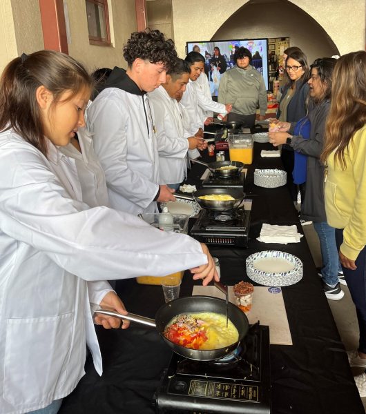 Ms. Fulton and other staff members wait for the FFA students to customize their omelets on Friday, August 18th. The breakfast is an annual start-of-school tradition.
