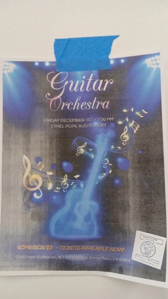 Flyers were posted all over campus to advertise for the third annual guitar orchestra performance.