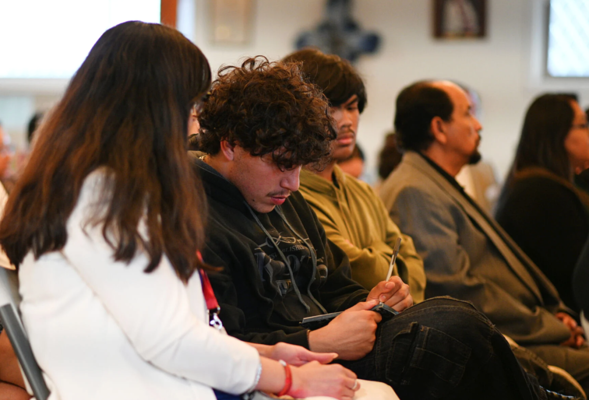 Audience members taking notes during the candidacy forum for Santa Maria Council. (photo provided by Santa Maria Times)